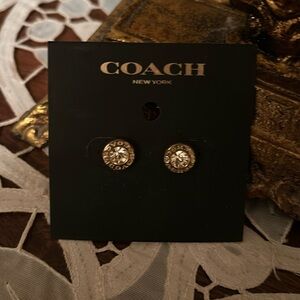 Coach gold toned stud earrings with rhinestone centre